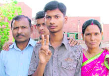  Hemant Kumar (second from right), who scored the 2,616 rank in the IIT examination, with his parents in Ludhiana on Saturday.