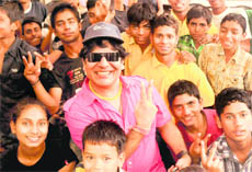 Slum children adopted by Theatre Age, along with Bollywood lyricist Anil Jhingran, at Government High School, Sector 24, Chandigarh, on Sunday. 