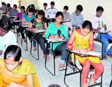 Students appearing in a polytechnic examination conducted by UTEC at the SDIMT centre in Haridwar on Sunday