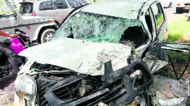 The mangled remains of a car that collided with a bus in Fatehabad on Sunday.