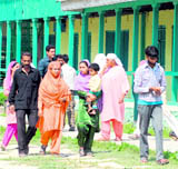Voters outside a polling station in Kakapora block of Pulwama district.