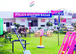 A file photo of the model Sadar police station; and (right) police personnel are forced to sleep outside the newly constructed Kotwali police station in Ludhiana in the absence of facilities
