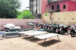 A file photo of the model Sadar police station; and (right) police personnel are forced to sleep outside the newly constructed Kotwali police station in Ludhiana in the absence of facilities