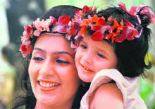 A mother-daughter duo is all smiles while participating in a programme organised by Lakshmi Ladies Club in Ludhiana