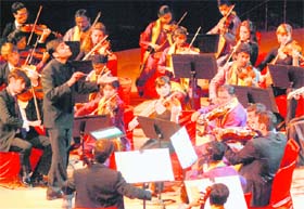 Members of India Youth Orchestra perform at Siri Fort Auditorium in New Delhi on Sunday