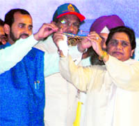 Anwar-ul-Haq, president of Chandigarh unit of the BSP, offers a gold crown to Mayawati during a rally in Chandigarh on Sunday