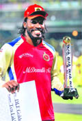RCBs Chris Gayle with his Golden Player of IPL-4 trophy