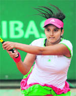 Sania Mirza hits a backhand return in the womens doubles match in Paris on Sunday. 
