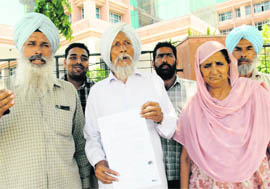 Landowners of Ferozepore Banga village protest outside the GMADA office against the acquisition of land for the Medicity project. 