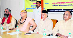 Former Chief Minister Bhagat Singh Koshyari (in black cap) and Jagadguru Shankaracharya Raj Rajeshwaram (on his right) at the concluding session of the All-India Sanskrit Research Convention in Haridwar on Monday.