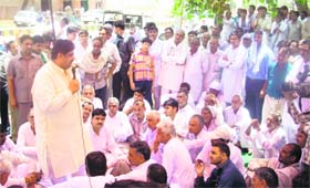INLD leader Ajay Singh Chautala addresses farmers protesting against land acquisition at Agroha, near Hisar, on Monday