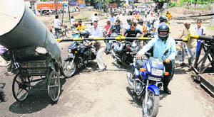 Unaware of the risk involved, people cross a closed level crossing at the Old Radore road in Yamunanagar. 