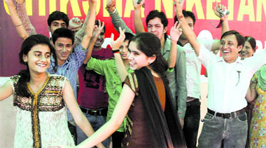 Students of a private school celebrate after the declaration of the Class X results in Jammu on Monday.