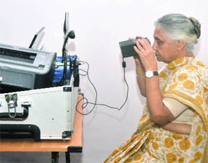 Chief Minister Sheila Dikshit gets herself biometrically enumereted for the National Population Registry at her residence in New Delhi 
