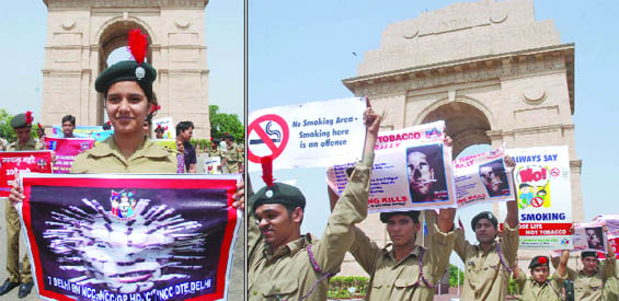 The NCC cadets hold placards and make a human chain as they participate in an anti-tobacco rally to mark World No Tobacco Day at India Gate in New Delhi