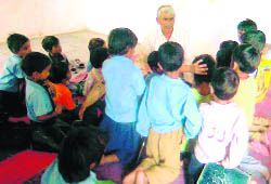 Primary school students study in an old buildling lacking basic facilities in Jagjeetpur in Haridwar.