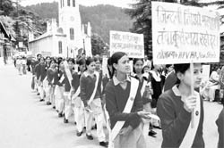 Schoolchildren hold placards during an awareness rally on World No Tobacco Day on the Ridge in @@Shimla on Tuesday. 