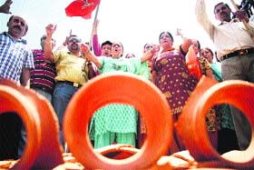Activists of the BJP stage a protest in Jammu on Tuesday