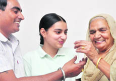 Mehnaz Kaur who ranked 41 with her father and grandmother at Jodha village near Ludhiana