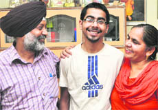 Gursharan Singh (rank 311) with his parents in Ludhiana