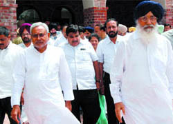 Bihar Chief Minister Nitish Kumar and BJP president Nitin Gadkari coming out of the Badals mansion after paying their condolences over the demise of Punjab Chief Minister Parkash Singh Badals wife Surinder Kaur Badal, at Badal village