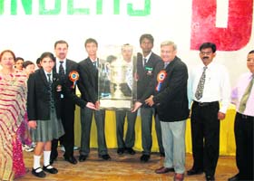 The chief guest, ADGM, Northern Railway, BP Gupta, presents the Cock House trophy to the winners at the Founders Day function of Oak Grove School at Mussoorie on Wednesday