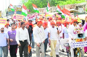 Activists of the Patanjali Yog Samiti and the Bharat Swabhiman Manch take out a procession in support of the proposed indefinite fast by yoga guru Baba Ramdev in New Delhi against corruption, in Rohtak on Wednesday
