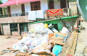 Waste dumped in the open by a pharma unit at Chambaghat in Solan. 