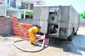 A fire tender pressed into service to supply water to an officers house in the Channi Himmat locality of Jammu