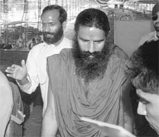 Yoga guru Ramdev inspects the pandal at Ramlila ground in New Delhi where he will sit on a fast from June 4