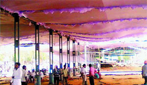 Workers prepare the new venue for the bhog ceremony of Surinder Kaur Badal, at the grain market in Malout 