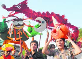 Participants with their creations at a grand puppet parade at the Sector 17 Plaza in Chandigarh on Thursday