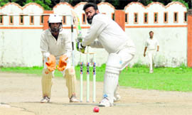 A batsman in action in the DST-SOI Cricket Tournament played in Dehradun on Thursday.