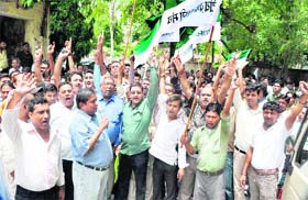 Activists of the Rashtriya Krantikari Manch hold a protest against the state government in Haridwar on Thursday