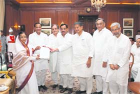 Uttarakhand Congress leaders present a charge sheet against the state BJP government to President Pratibha Patil at Rashtrapati Bhawan in Delhi on Thursday