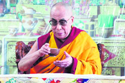 Spiritual leader Dalai Lama takes tea on the inauguration of the new building of Kashag (Tibetan cabinet) at Dharamsala on Thursday. 
