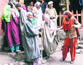  Abdul Karim Bhat, oldest man of Gulshanpora village of Pulwama district, comes out of a polling booth after casting his vote  