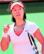 Chinas Li Na reacts after a point against Maria Sharapova in the semifinal of the French Open Championship at the Roland Garros Stadium in Paris on Thursday
