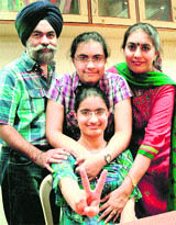 Harsimran Bhatia, who secured second rank in CET-medical, with family.