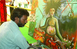 Bharat Swabhiman: An activist-cum-artist, Tabrez Alam makes a painting on corruption and black money at Ramlila Grounds in New Delhi on Friday.