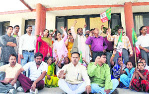Members of the Uttarkhand Kranti Dal (Panwar faction) hold a demonstration against the power tariff hike at the headquarters of the Uttarakhand Power Corporation in Dehradun 