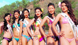 Participants of the Miss Tibet contest (from R) Chemi Lhazom from Delhi, Dolma Tsering Bangalore, Ngodup Dolma Australia, Tenzin Khecheo the USA, Tenzin Sangmo Dharamsala and Tenzin Yangkyi from Switzerland during the swim suit round along the Manji rivulet in Khaniyara village near Dharamsala on Friday