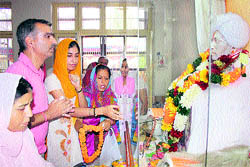 Devotees offer prayers at Bhagwan Gopinathji Ashram at Bohri in Jammu on Friday