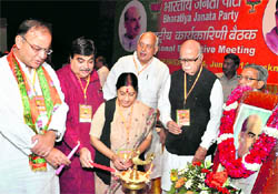 BJP national president Nitin Gadkari and senior leaders LK Advani, Sushma Swaraj, Arun Jaitley and Surya Pratap Shahi light lamps during partys national executive meeting in Lucknow on Friday
