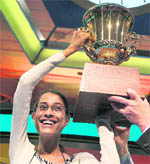 Sukanya Roy of Pennsylvania with the trophy after winning the 2011 Scripps National Spelling Bee competition.