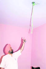 A police official inspects the room where the suicides took place