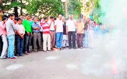 People celebrate the inclusion of communities residing in the Rawanlta-Jaunpur area in the OBC list at Mussoorie on Saturday.