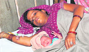 Seema with her baby at the district hospital in Ambala. 