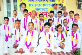 Supporters of Baba Ramdev sit on dharna at Dharamsala on Saturday