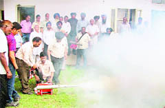 Trial Run Mayor Hakam Singh Gyaspura and MC officials inspect a fogging machine.